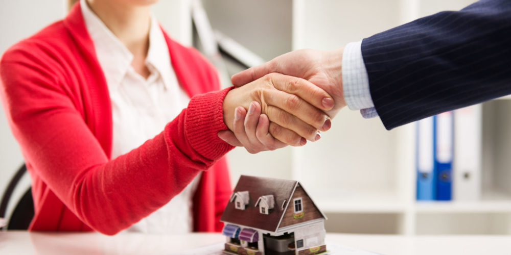 47948359 - two business people shaking hands as successful agreement